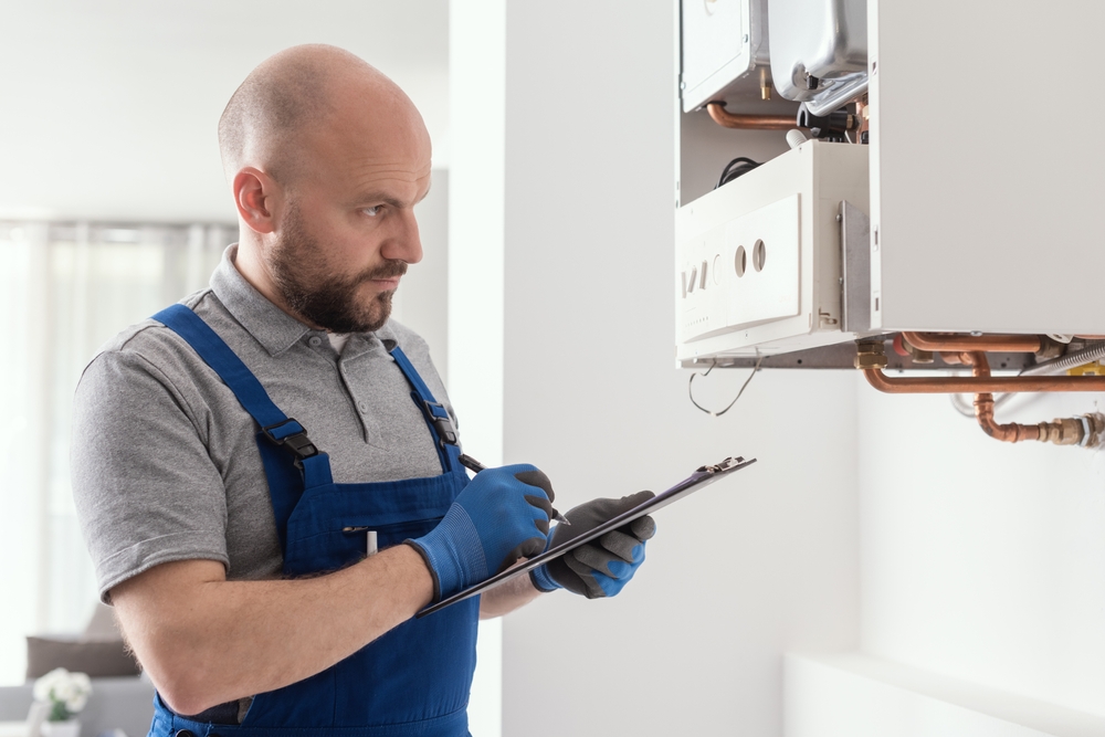Gas Safe engineer completing a boiler service checklist
