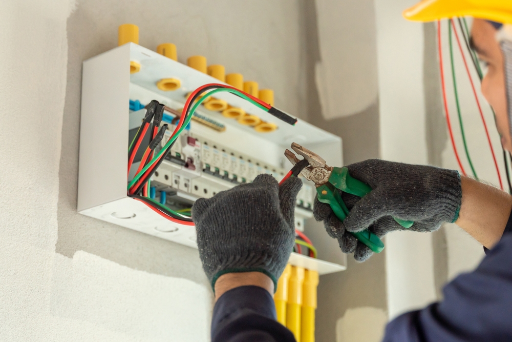 Electrician working on a consumer unit